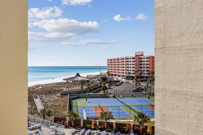 Enjoy a game of tennis on the hotel's court, overlooking the adjacent beach and ocean.