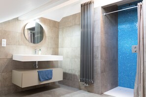 Combined shower/tub, hair dryer, towels, toilet paper