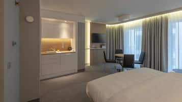 Suite, 1 Queen Bed, Balcony | In-room safe, laptop workspace, blackout drapes, soundproofing