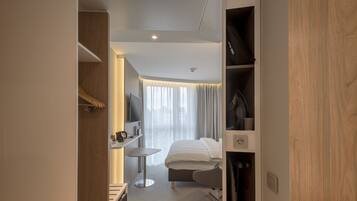 In-room safe, laptop workspace, blackout drapes, soundproofing