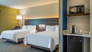 A hotel room with two beds, a microwave, a coffee maker, and a refrigerator. - Holiday Inn Express & Suites Watertown by IHG (Watertown)