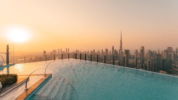 2 outdoor pools, open 9:00 AM to 7:00 PM, pool umbrellas, pool loungers