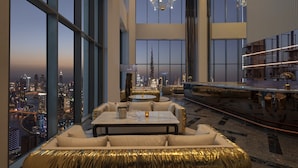 A high-rise hotel interior with a panoramic city view, a chandelier, and a bar area. - SLS Dubai Hotel & Residences (Dubai)