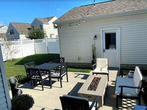 Relax in the patio area with a fire feature and comfortable seating for four.