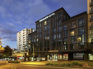 A modern hotel building with a prominent "Mercure Hotel" sign. - Mercure Auckland Queen Street (Auckland)