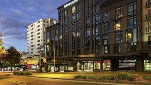 A modern hotel building with a prominent "Mercure Hotel" sign. - Mercure Auckland Queen Street (Auckland)