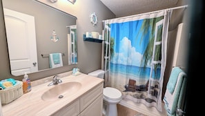 Combined shower/tub, hair dryer, towels, soap