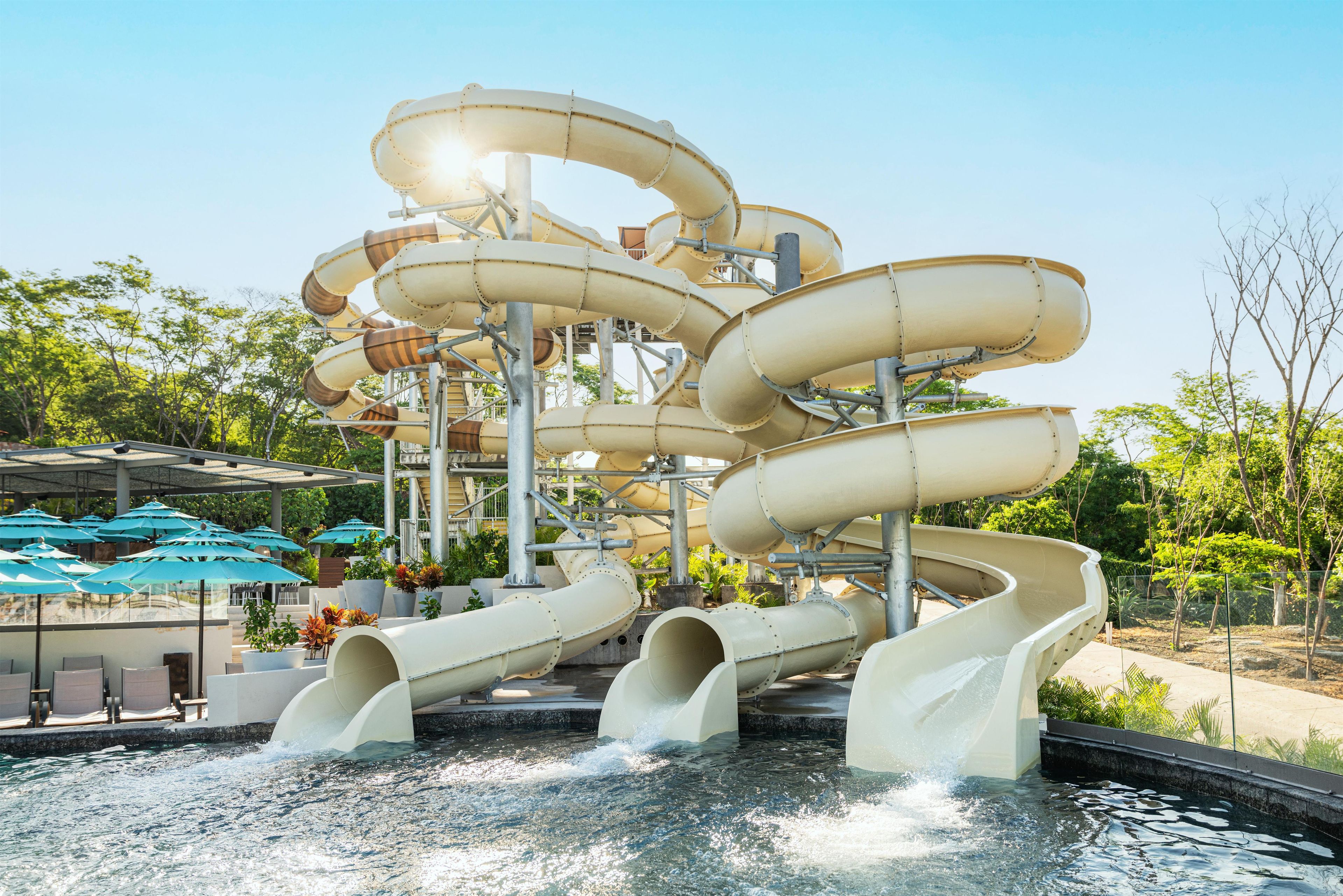 A water park with multiple water slides and a pool area.