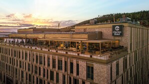 A hotel with a brick facade, a balcony with outdoor seating, and a sign indicating it is the Clarion Hotel. - Clarion Hotel Sundsvall (Sundsvall)