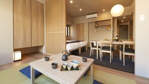 A modern hotel room with a bed, a dining area, and a seating area with a table and chairs. - MONday Apart Premium GINZA SHINTOMICHO (Tokyo)