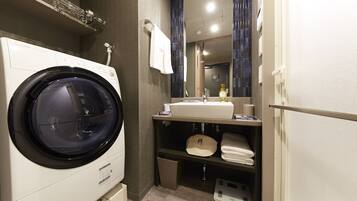 Separate tub and shower, hair dryer, slippers, electronic bidet