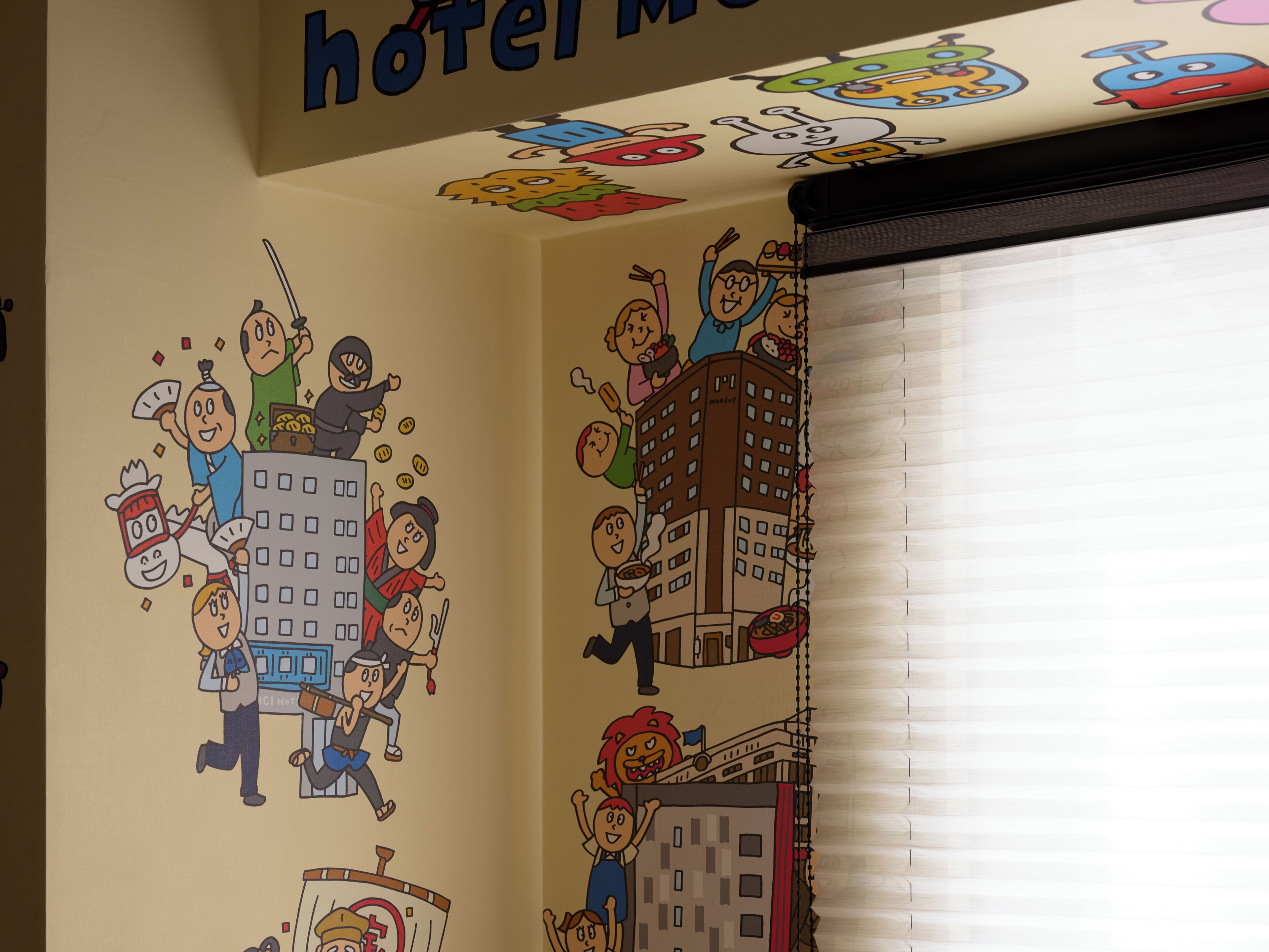A hotel interior with a wall mural depicting cartoon characters in various activities, a ceiling sign reading 'hotel M,' and a window with blinds.
