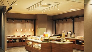 A modern kitchen with a central island, built-in appliances, and pendant lighting. - hotel MONday Kyoto Marutamachi (Kyoto)