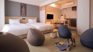 A hotel room with two beds, a dining area, and a kitchenette. - MIMARU Osaka Shinsaibashi East (Osaka)