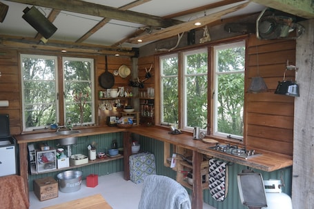 Fridge, stovetop, coffee/tea maker, electric kettle. Old Brett Rd Hut