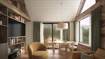 A modern living room with a large bookshelf, a round dining table, and a comfortable seating area.