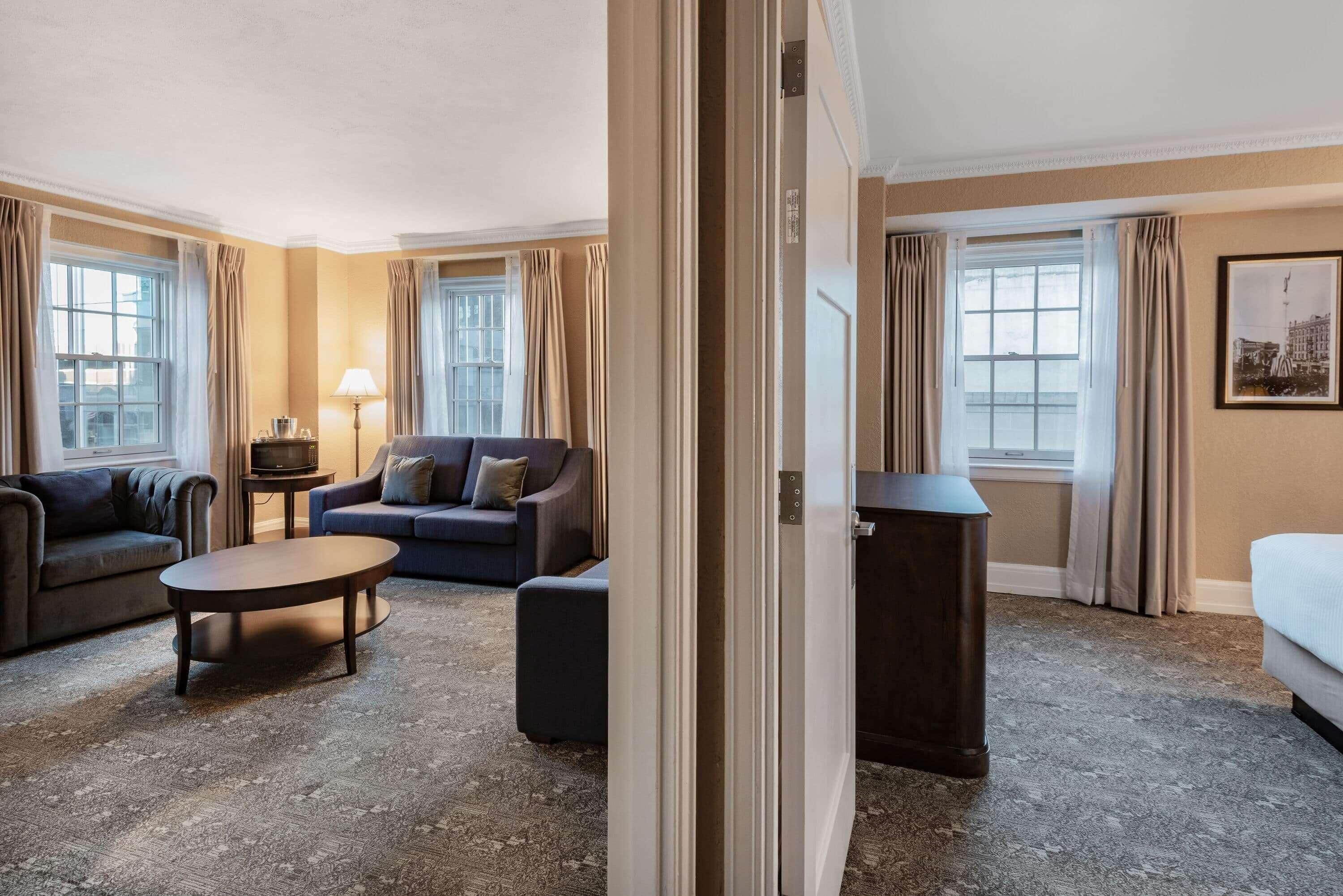 Luxury Suite, 2 Bedrooms (1 King Bed & 1 Queen Bed) | In-room safe, desk, laptop workspace, blackout drapes