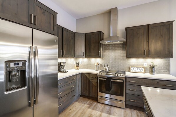 Enjoy cooking in this well-equipped kitchen with a refrigerator, range, and oven.