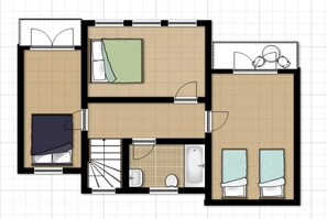 Plano de un hotel con dos dormitorios, un baño, una cocina y una sala de estar.