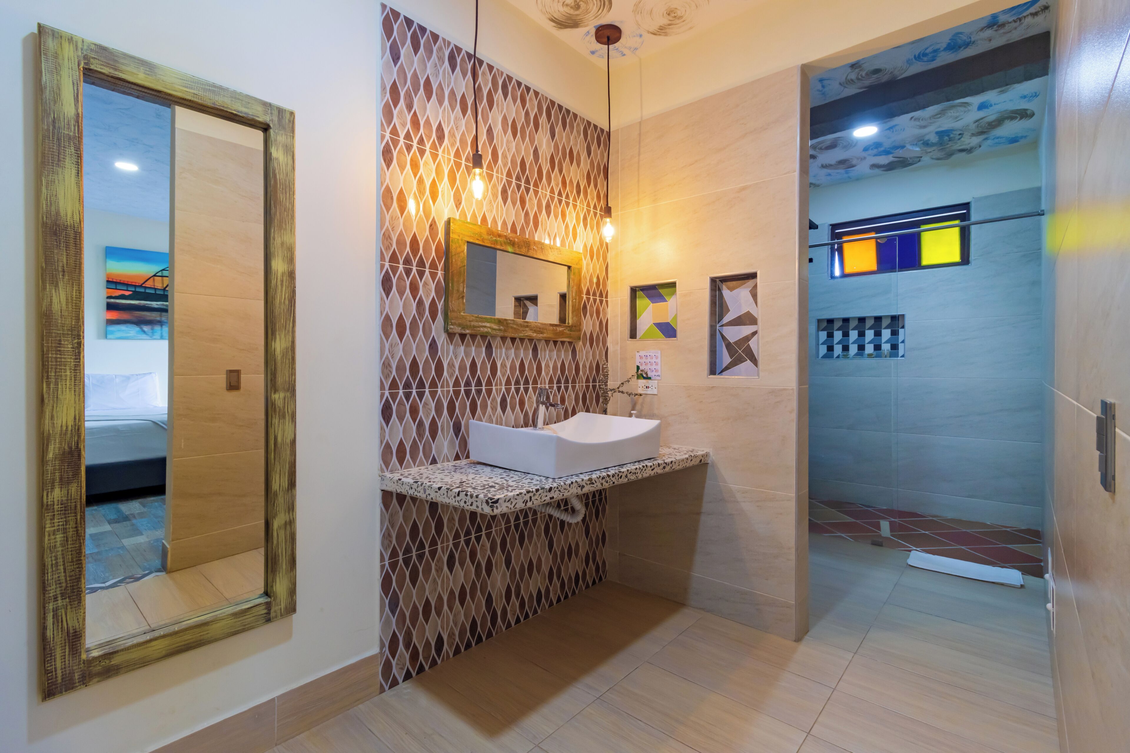 A bathroom with a sink, mirror, and decorative wall panels.