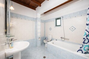 Bathtub, hair dryer, towels