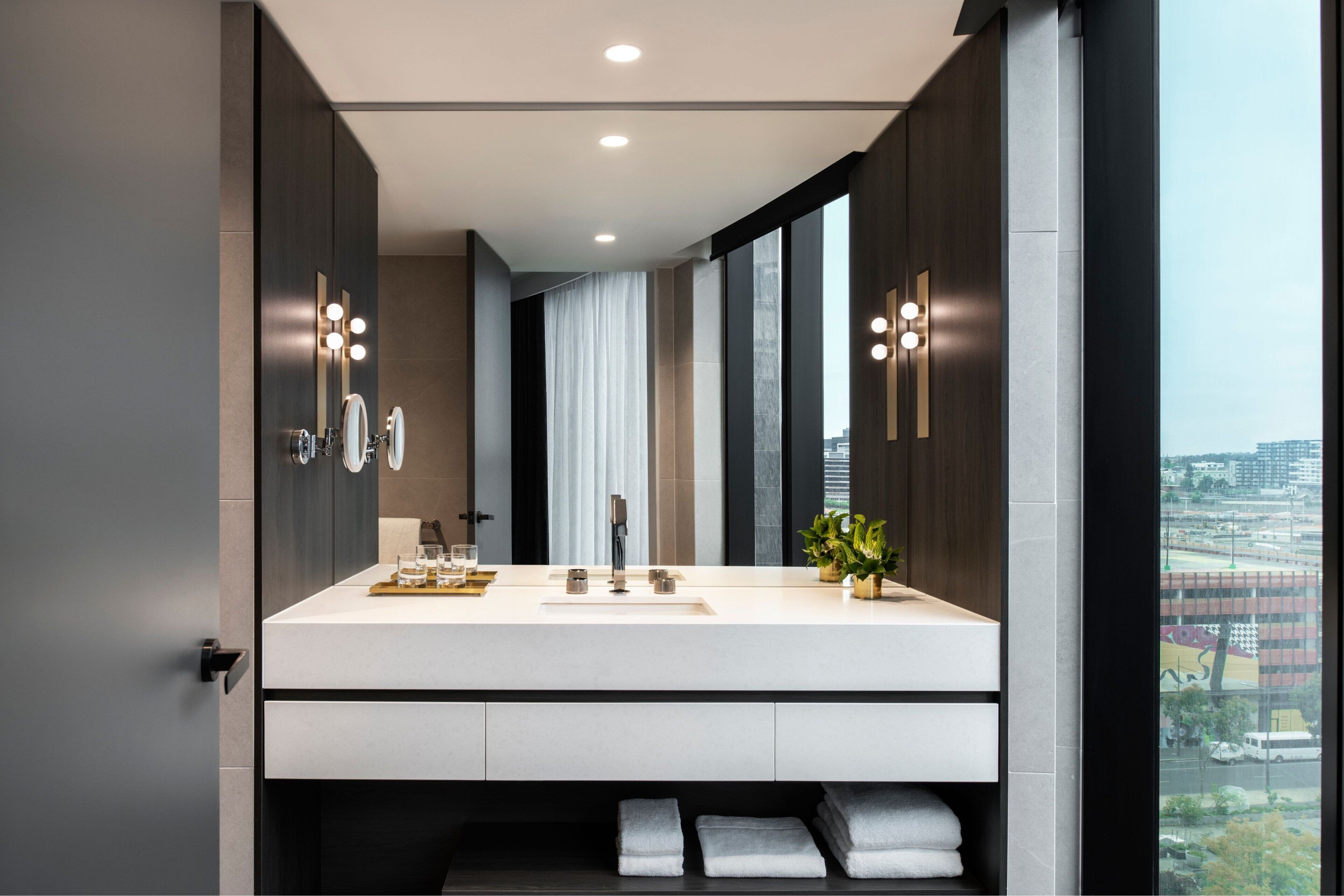 designer toiletries, hair dryer, bathrobes, towels