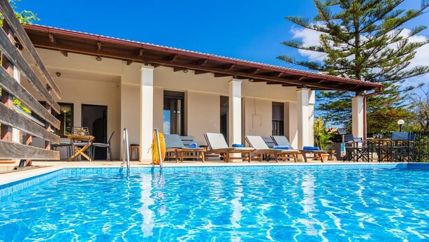 A swimming pool with lounge chairs and a covered seating area. - Villa Maro Large Private Pool, A/C, WiFi (Kefalas)