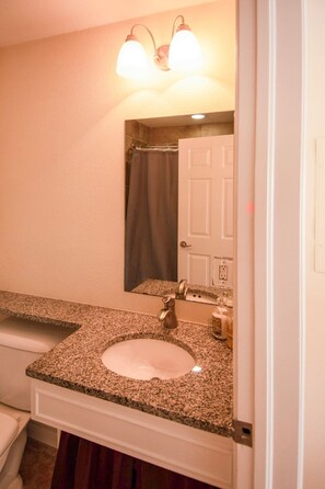 Combined shower/bathtub, hair dryer, towels, soap