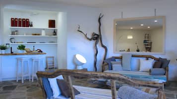 Villa, Beachfront | Living area | Flat-screen TV