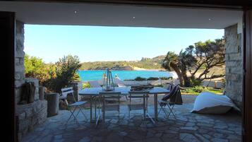 Enjoy a romantic meal overlooking the ocean and sandy beach.