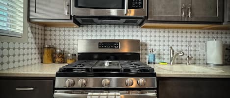 Microwave, coffee/tea maker, cookware/dishes/utensils