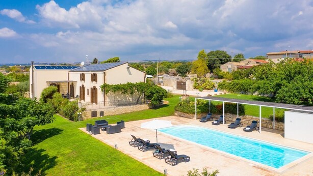 A residential property with a swimming pool, outdoor seating, and a view of the surrounding landscape. - Villa Palazzola - Five Bedroom Villa, Sleeps 12 (Scicli)