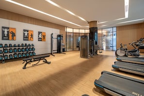 A gym with treadmills, weight machines, and dumbbells. - Holiday Inn Shanghai Nanjing Road by IHG (Shanghai)