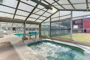 Relax by the pool, surrounded by a transparent roof and scenic views.