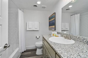 Bathtub, hair dryer, towels