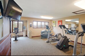 A gym with treadmills, elliptical machines, and a water dispenser. - RA513 | Newly Listed | Amazing Views | Winter Shuttle | Pool | Hot Tubs (Steamboat Springs)