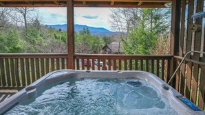 A hot tub with a wooden deck and a view of mountains and trees. - Hemlock Ridge 1713 - Mountain View from Hot Tub (Gatlinburg)