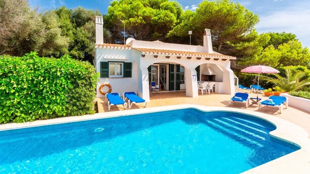 A villa with a swimming pool, outdoor seating, and a garden. - Villa Binibety - Three Bedroom Villa, Sleeps 6 (Binibeca)