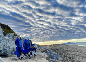 On the beach, sun loungers, beach towels