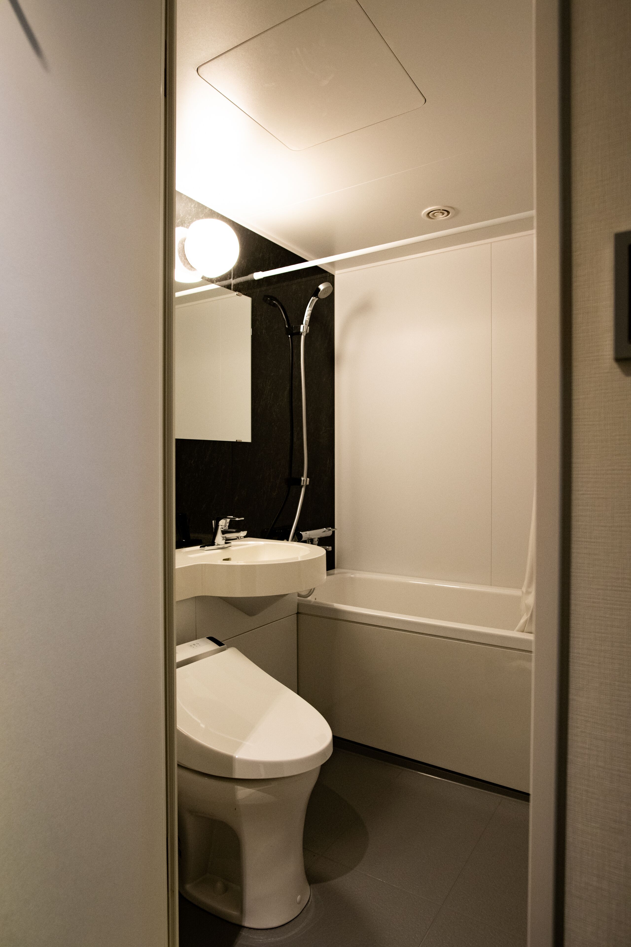 hair dryer, slippers, electronic bidet, towels