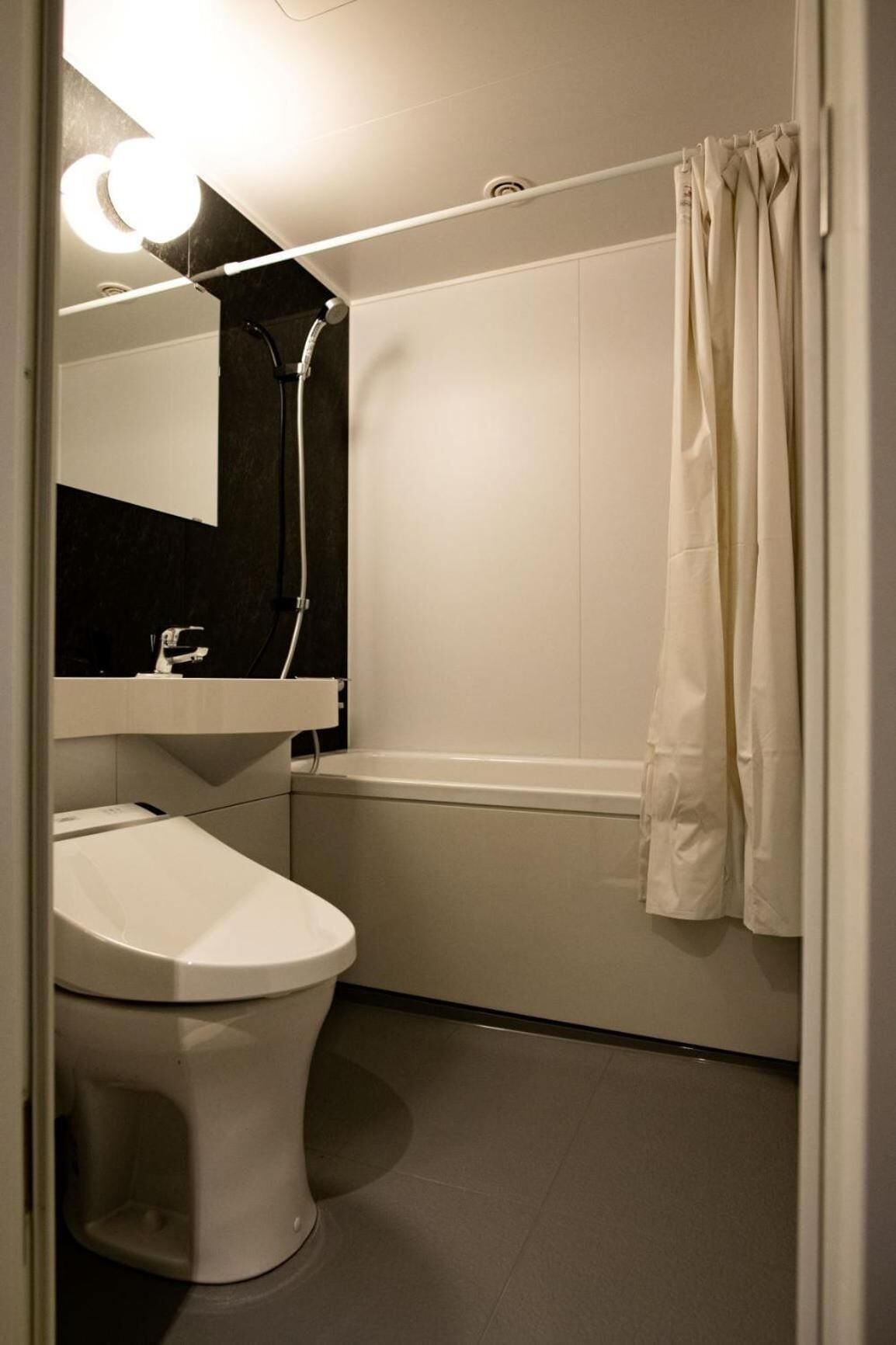 hair dryer, slippers, electronic bidet, towels