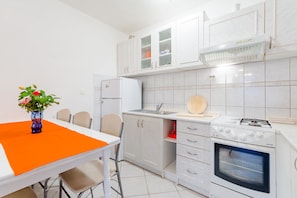 Apartment (Three-Bedroom Apartment with Pool) | Private kitchen | Fridge, microwave, stovetop, coffee/tea maker