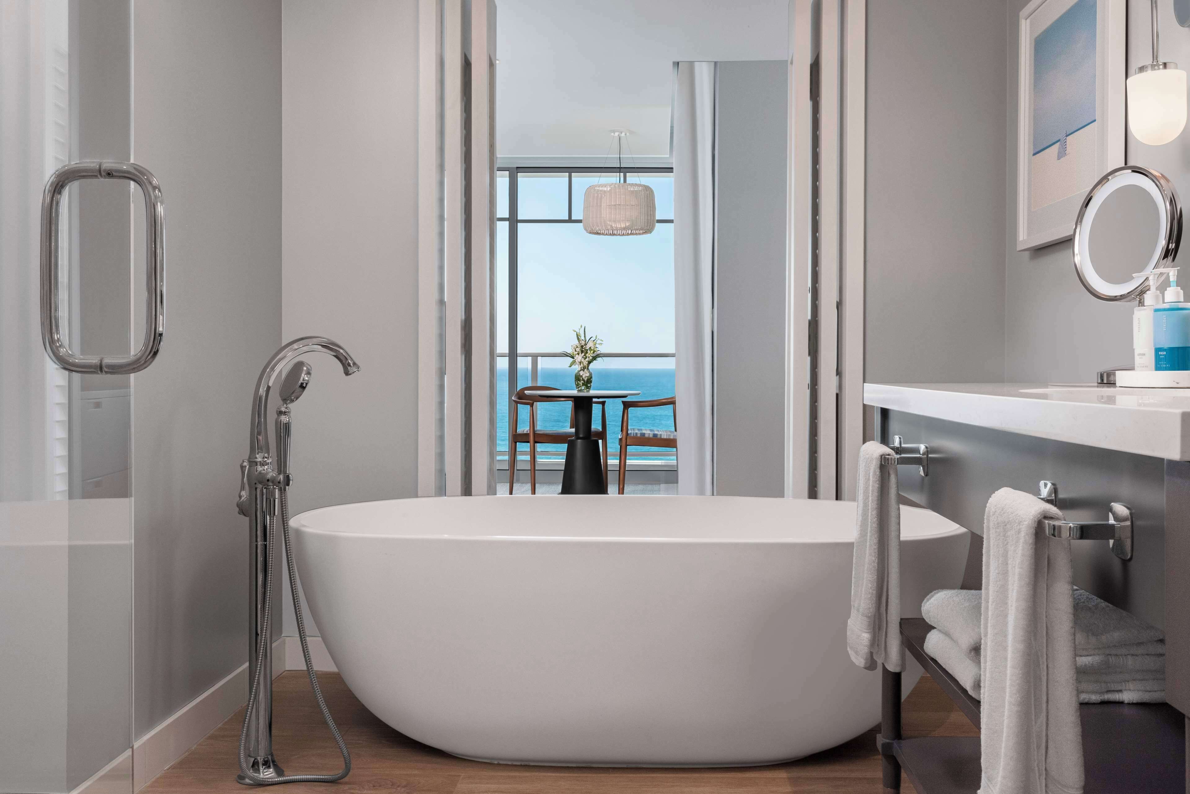 premier room, 1 king bed, oceanfront | bathroom | designer toiletries, hair dryer, bathrobes, slippers