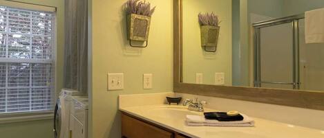 Main Level Foyer Bathroom with Shower and Laundry Area