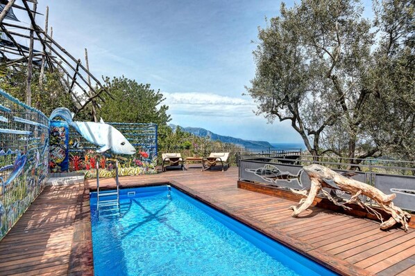 Seasonal outdoor pool, pool loungers