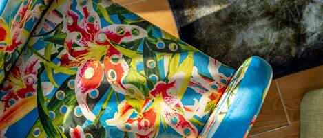 A colorful fabric with a floral pattern, possibly a tablecloth or decorative item.