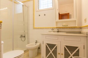 Bathtub, hair dryer, towels