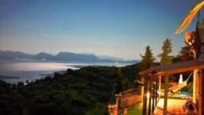 A coastal view with a wooden structure overlooking a body of water and mountains. - Executive Villa Madouri With Private Pool (Lefkada)