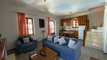 Villa | Living room | 30-inch TV with digital channels, fireplace