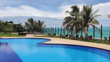 2 outdoor pools, open 7:00 AM to 10:00 PM, pool umbrellas, pool loungers